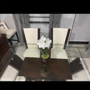 Buffet table and the table with 2 chairs.